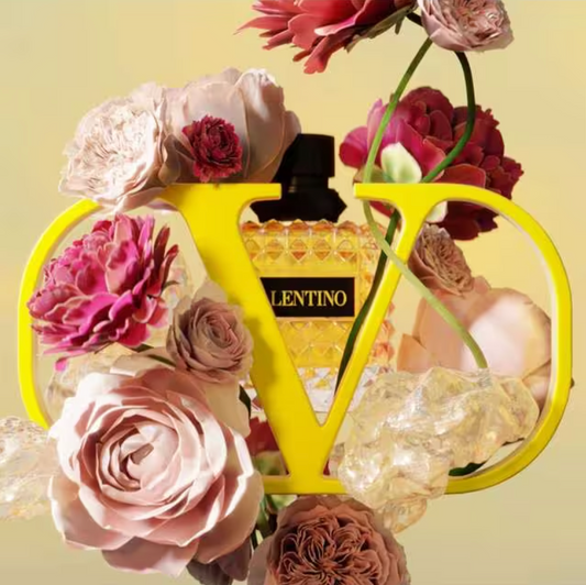 Lentino perfume bottle with flowers on a yellow background